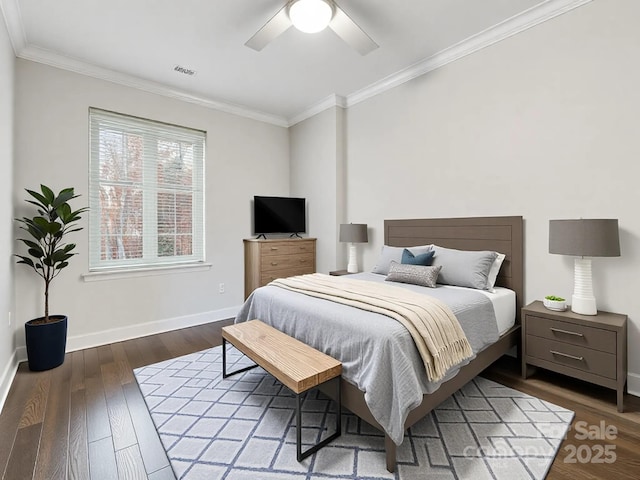 bedroom with visible vents, ornamental molding, ceiling fan, wood finished floors, and baseboards