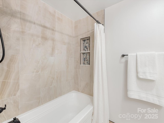 full bathroom with shower / tub combo