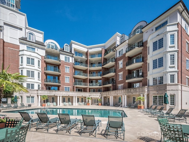 community pool with a patio