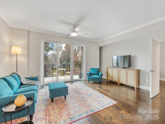 living area with ornamental molding, baseboards, and hardwood / wood-style flooring