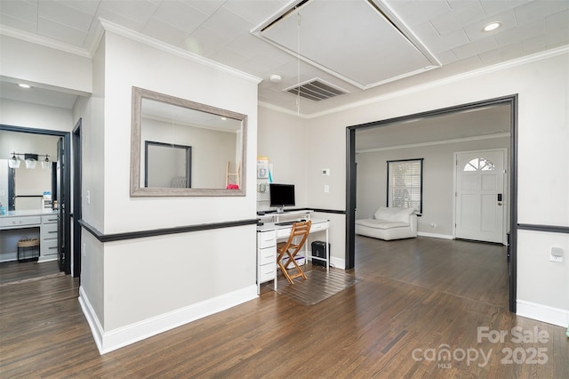 kitchen featuring dark wood-style floors, visible vents, ornamental molding, and baseboards