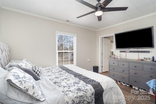 bedroom with ceiling fan, ornamental molding, wood finished floors, and visible vents