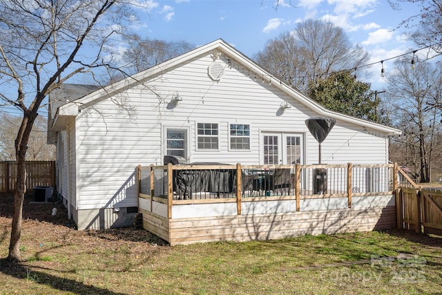 back of house featuring fence, cooling unit, and a wooden deck