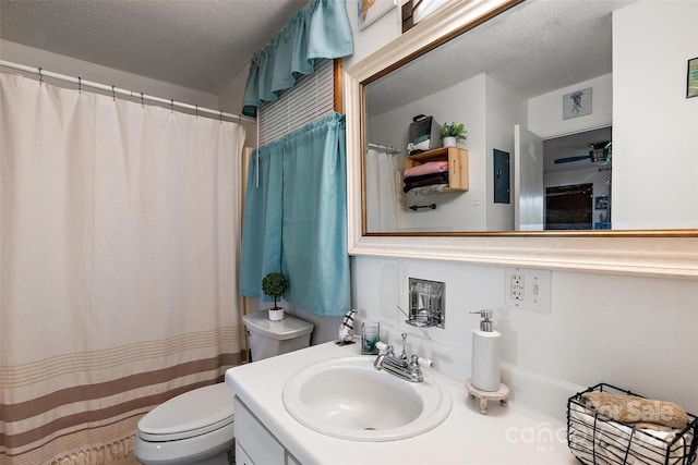 full bathroom featuring ceiling fan, a textured ceiling, toilet, and vanity