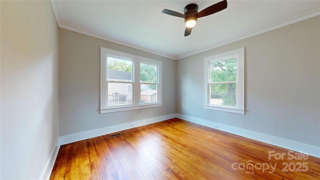 unfurnished room with baseboards, visible vents, a healthy amount of sunlight, and light wood-type flooring