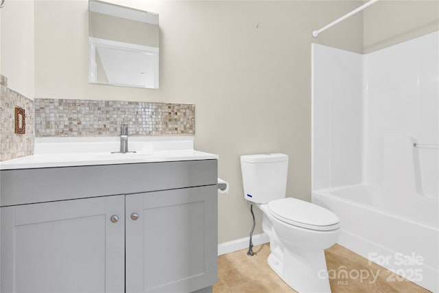 bathroom with  shower combination, vanity, and toilet