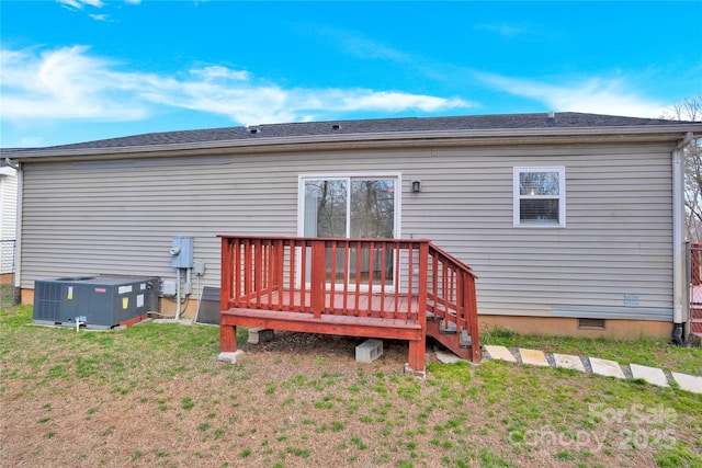 back of property with a yard, central AC unit, crawl space, and a wooden deck