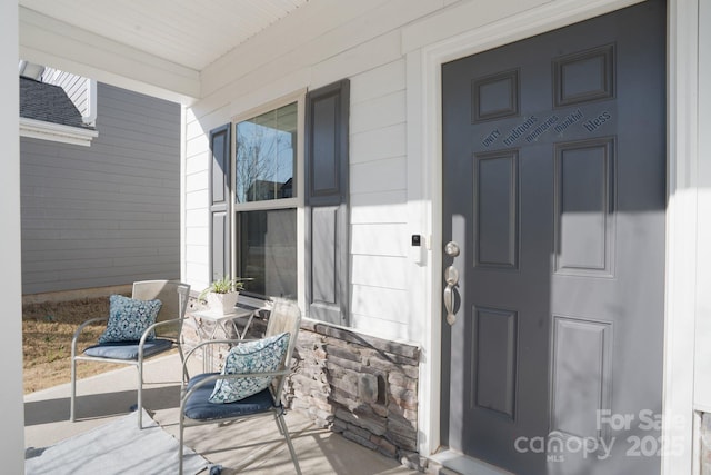 doorway to property featuring covered porch