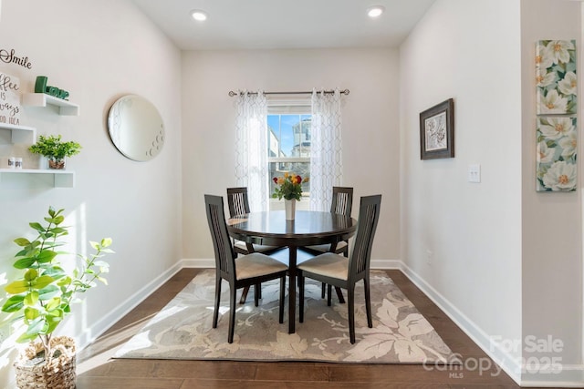 dining area with recessed lighting, dark wood-type flooring, and baseboards