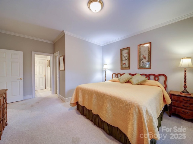 carpeted bedroom with baseboards and ornamental molding