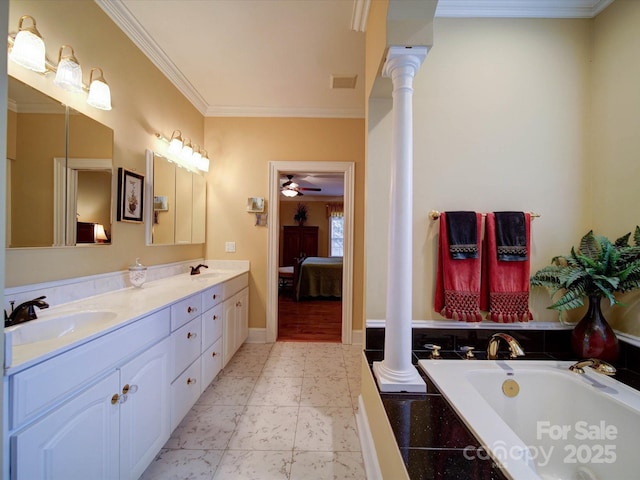 full bathroom with decorative columns, visible vents, ensuite bathroom, and a sink