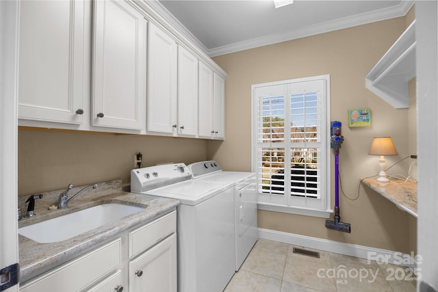 laundry room with cabinet space, visible vents, ornamental molding, a sink, and independent washer and dryer