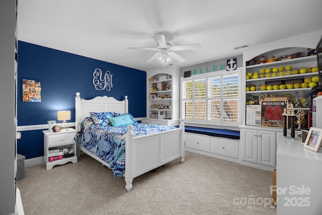 bedroom featuring light carpet, ceiling fan, and visible vents