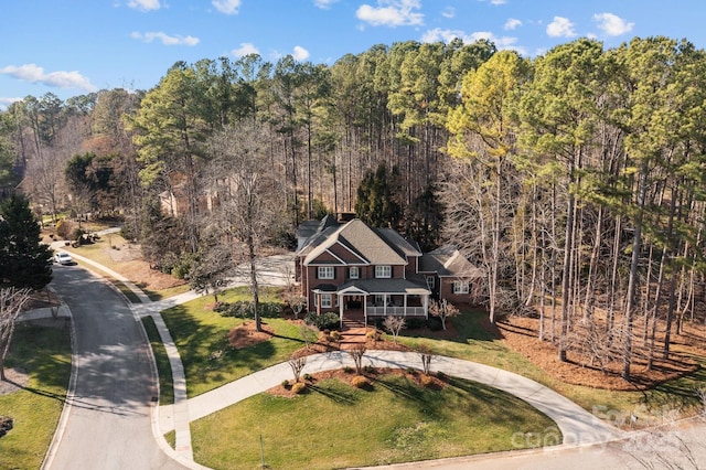 drone / aerial view with a forest view