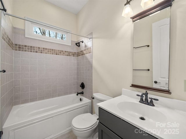 bathroom with vanity, toilet, and shower / bathtub combination