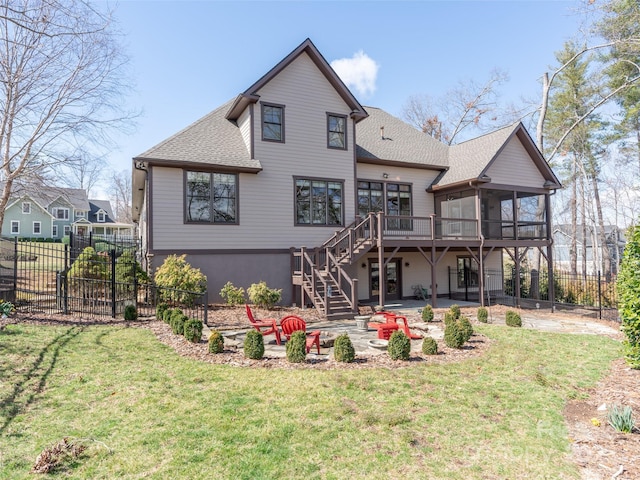 back of house with a yard, a patio, fence, and stairs