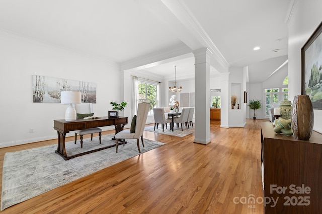 office area featuring a notable chandelier, light wood-style flooring, baseboards, and crown molding