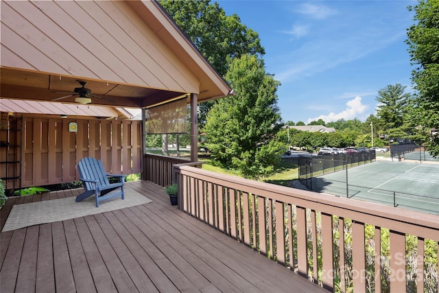 wooden terrace featuring a ceiling fan and fence