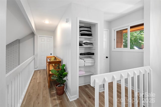 hallway with light wood finished floors