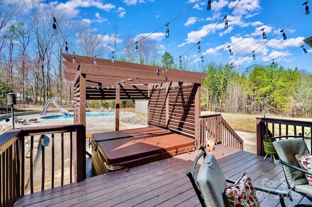 wooden deck with an outdoor pool and a pergola