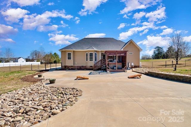 back of house featuring crawl space, a patio, stairway, and fence