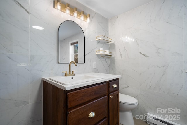 bathroom featuring toilet, vanity, tile walls, and a baseboard radiator