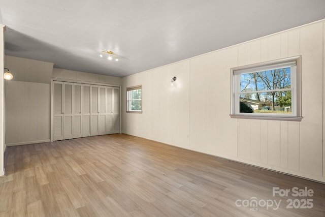 spare room with wood finished floors