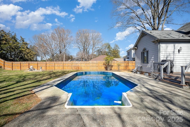 view of swimming pool featuring a yard, a patio area, a fenced backyard, and a fenced in pool