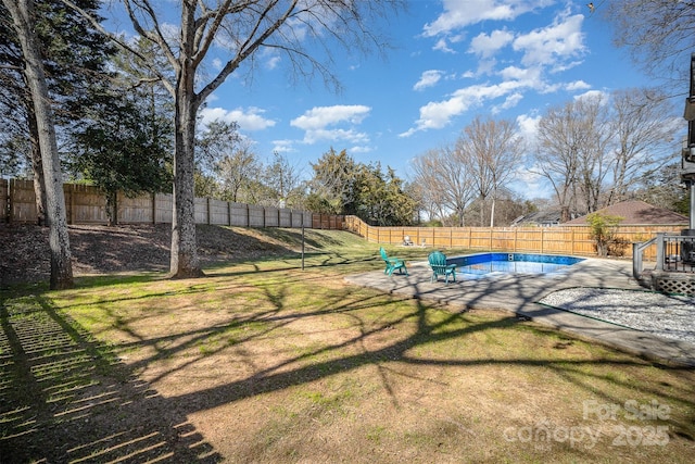 view of yard featuring a fenced in pool, a patio area, and a fenced backyard