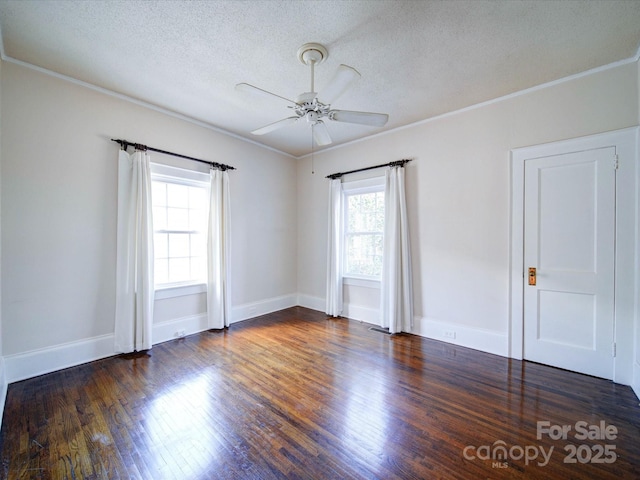 spare room with crown molding, ceiling fan, a textured ceiling, wood finished floors, and baseboards