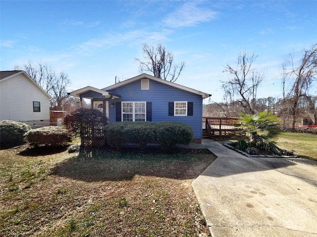 bungalow-style house with a deck