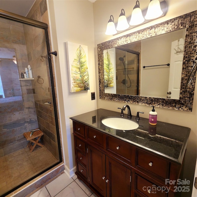 bathroom featuring a shower stall, vanity, and marble finish floor