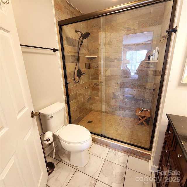 full bathroom with toilet, marble finish floor, and a stall shower