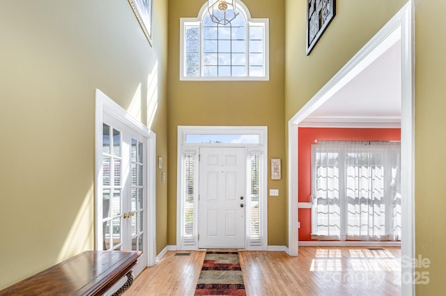 12723 Willingdon Rd, Huntersville, NC 28078 - foyer with a high ceiling, baseboards, and wood finished floors