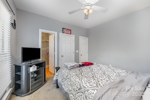 12723 Willingdon Rd, Huntersville, NC 28078 - bedroom featuring a ceiling fan, light carpet, and ensuite bathroom