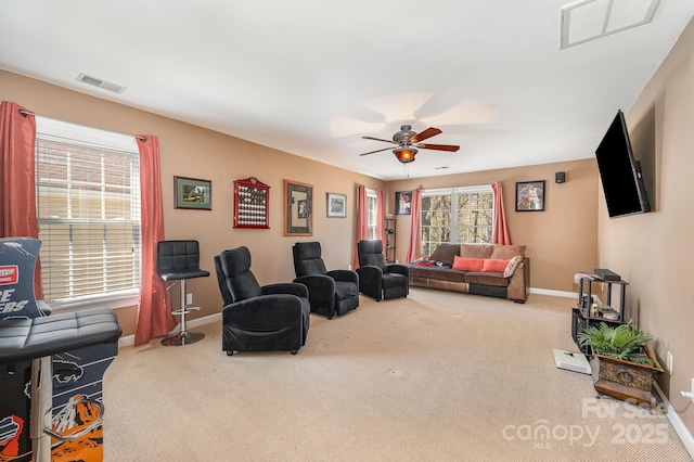 12723 Willingdon Rd, Huntersville, NC 28078 - carpeted living area with a ceiling fan, baseboards, and visible vents
