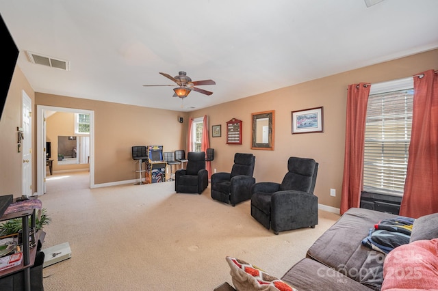 12723 Willingdon Rd, Huntersville, NC 28078 - carpeted living room featuring a ceiling fan, plenty of natural light, baseboards, and visible vents