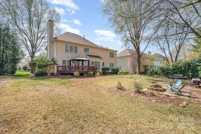 12723 Willingdon Rd, Huntersville, NC 28078 - rear view of property with a fire pit, a gazebo, a chimney, a deck, and a yard
