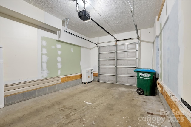 garage with baseboard heating and a garage door opener