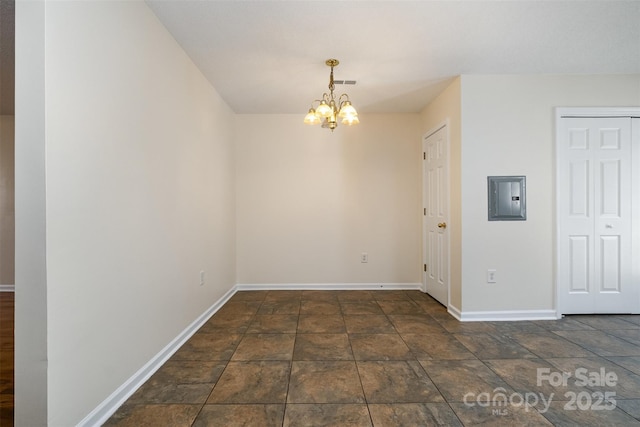 unfurnished room with visible vents, baseboards, a chandelier, electric panel, and stone finish floor