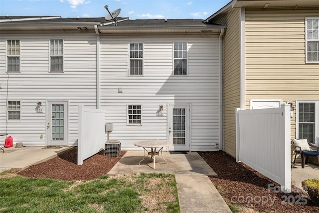 back of house with a patio and fence