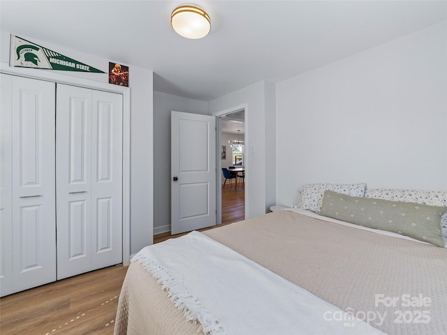 bedroom featuring a closet and wood finished floors