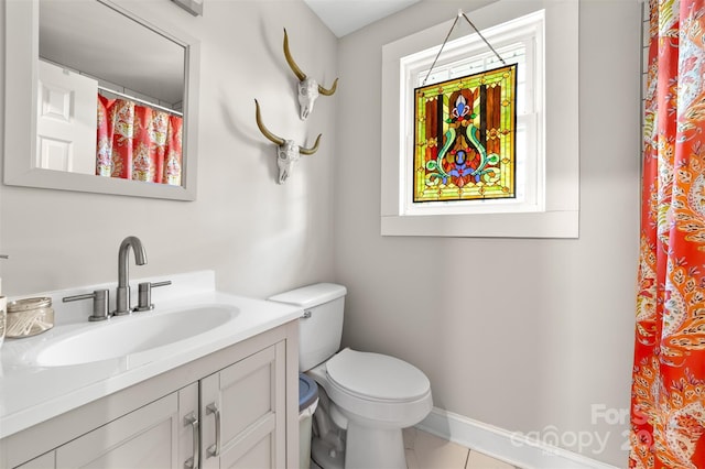 bathroom featuring toilet, tile patterned floors, vanity, baseboards, and a shower with curtain