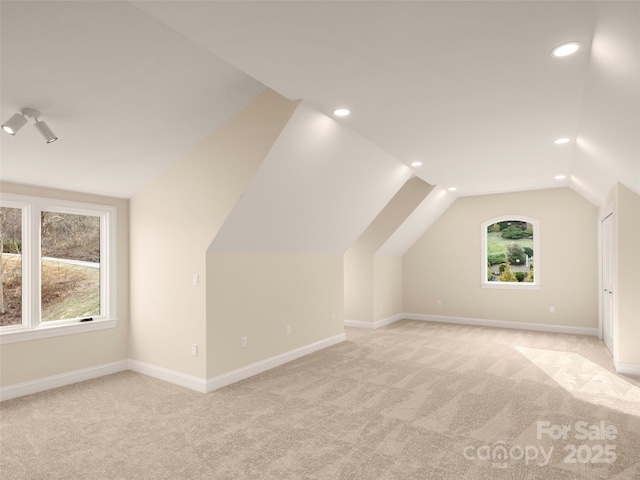 bonus room featuring lofted ceiling, recessed lighting, baseboards, and light carpet