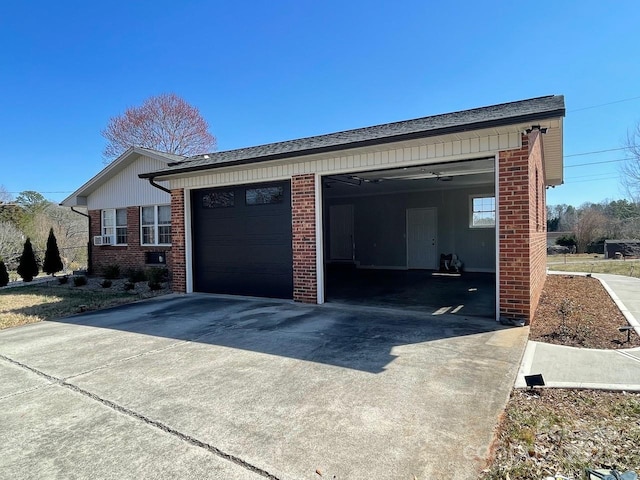 exterior space with brick siding and a garage