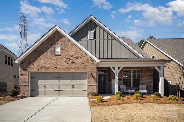 view of front of property featuring driveway, a porch, board and batten siding, an attached garage, and brick siding