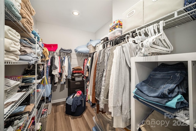 spacious closet with wood finished floors