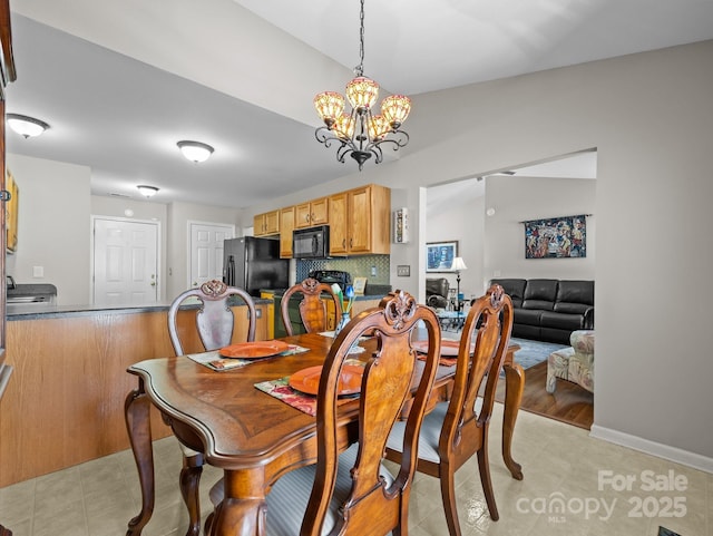 dining room featuring a notable chandelier