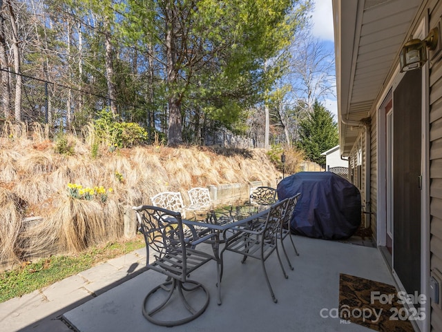 view of patio featuring outdoor dining area and grilling area