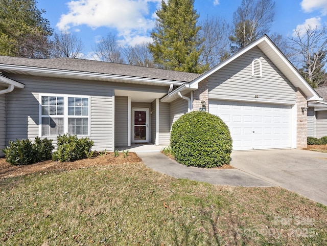 ranch-style house featuring brick siding, a front yard, concrete driveway, and an attached garage